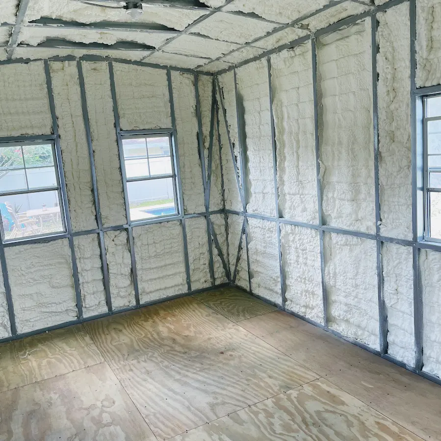 Closed-cell spray foam insulation applied to wall cavities in a residential project in Holladay